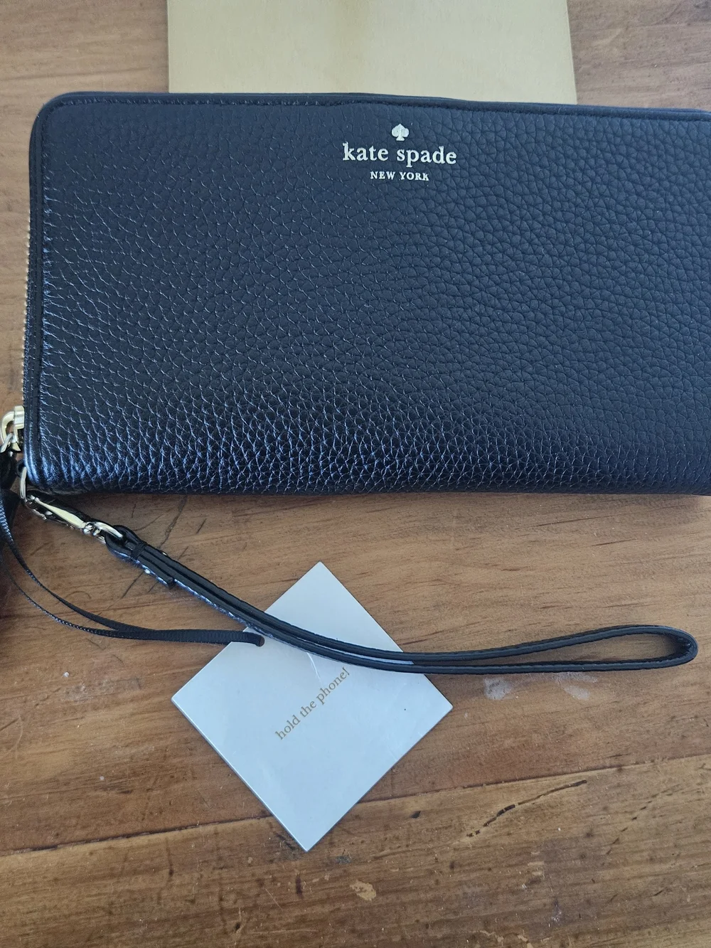 kate spade black pebbled leather wristlet clutch with gold logo